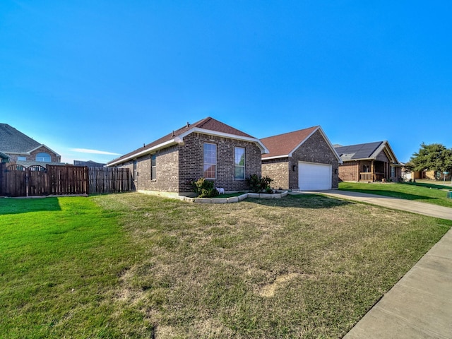 ranch-style home with a front yard and a garage