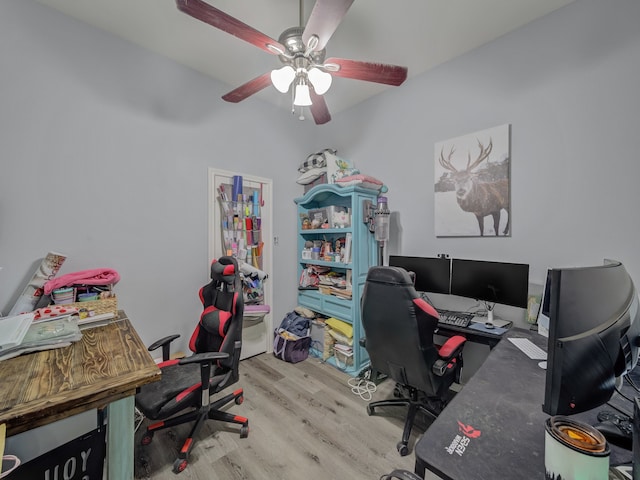 home office with ceiling fan and light wood-type flooring