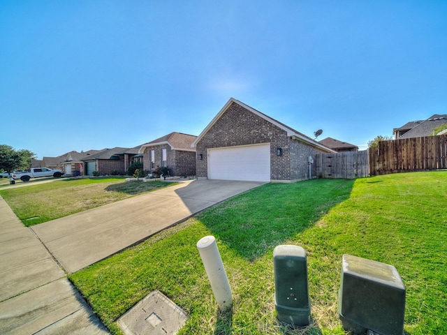 single story home featuring a garage and a front yard