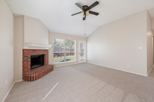 unfurnished living room with light carpet, a fireplace, ceiling fan, and vaulted ceiling