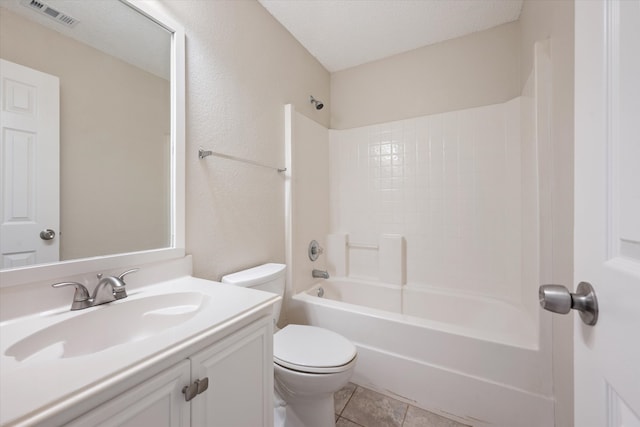 full bathroom with toilet, tile patterned floors, washtub / shower combination, vanity, and a textured ceiling