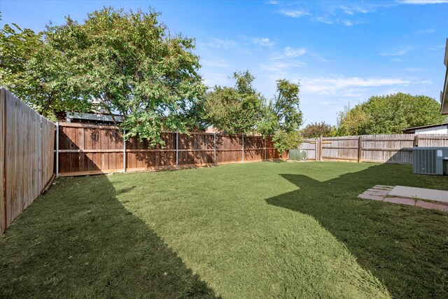 view of yard featuring central AC