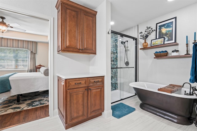 bathroom with ceiling fan, tile patterned floors, vanity, and shower with separate bathtub