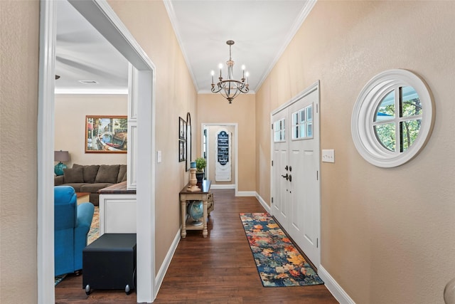 foyer featuring dark hardwood / wood-style flooring, a chandelier, and ornamental molding