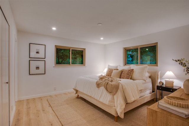 bedroom with light hardwood / wood-style flooring