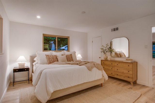 bedroom with light hardwood / wood-style floors