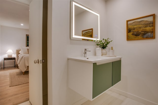 bathroom with vanity and hardwood / wood-style flooring