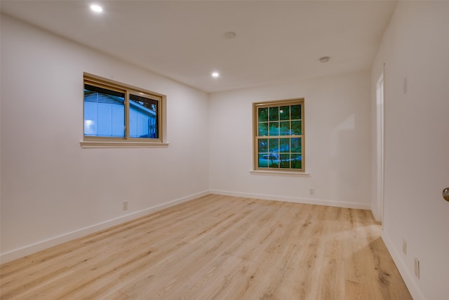 spare room featuring light wood-type flooring