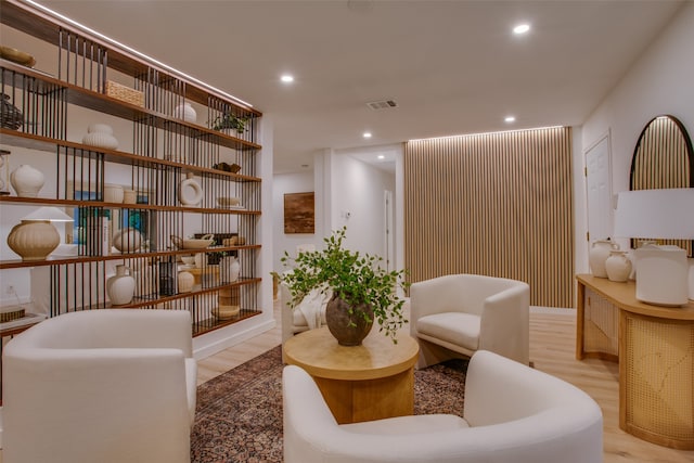 living area with light hardwood / wood-style flooring