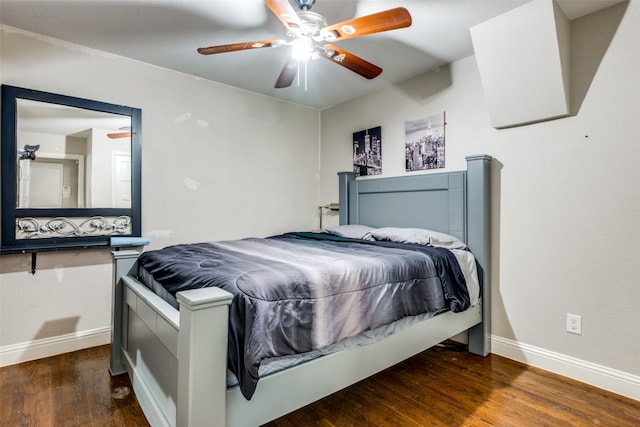 bedroom with ceiling fan and dark hardwood / wood-style flooring