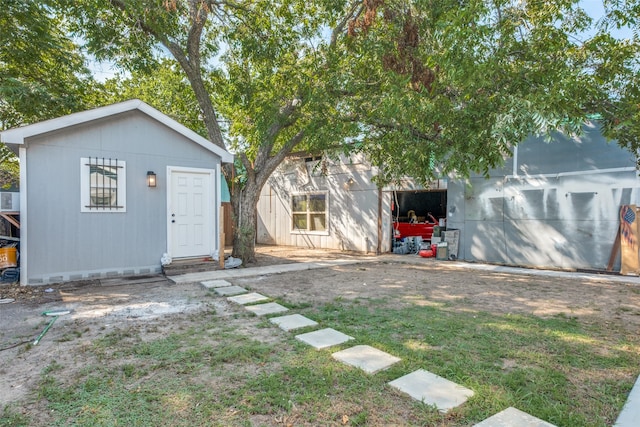 view of outbuilding featuring a yard