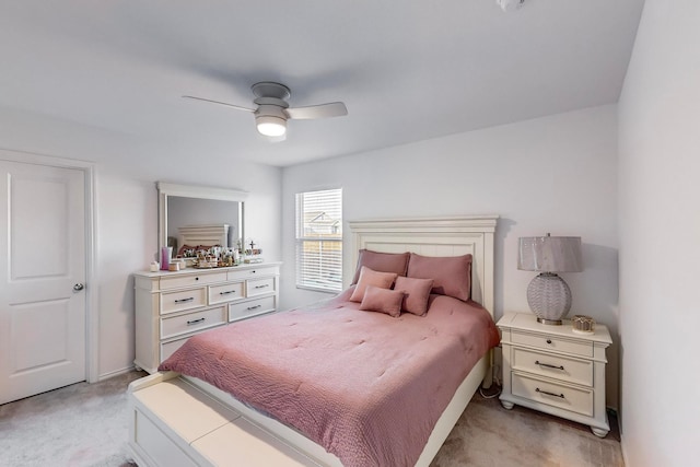 bedroom with light carpet and ceiling fan