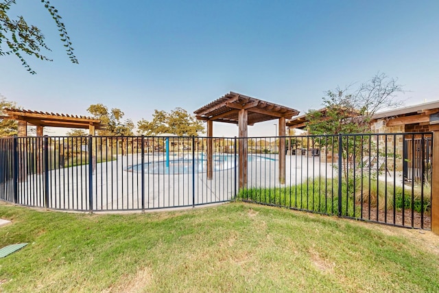 view of yard featuring a community pool and a pergola