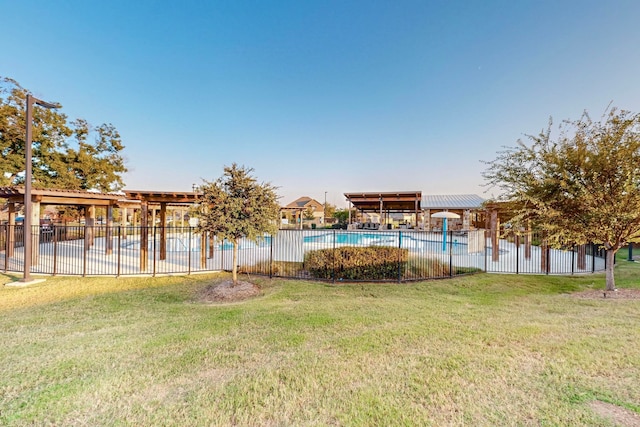 view of yard featuring a community pool