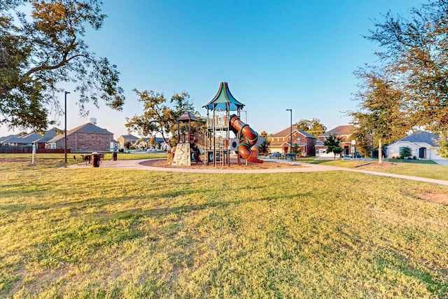 view of playground with a lawn