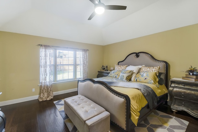 bedroom with ceiling fan, dark hardwood / wood-style floors, and vaulted ceiling