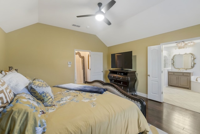 bedroom with hardwood / wood-style flooring, ceiling fan, lofted ceiling, and ensuite bathroom