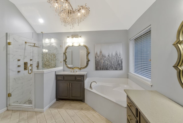 bathroom featuring tile patterned floors, vanity, vaulted ceiling, separate shower and tub, and a chandelier