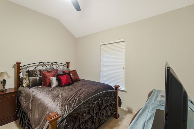 carpeted bedroom featuring vaulted ceiling and ceiling fan