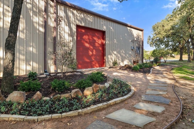 view of home's exterior with an outdoor structure