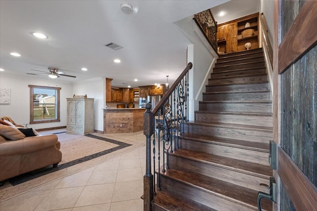 stairs with recessed lighting, visible vents, a ceiling fan, tile patterned flooring, and baseboards