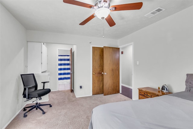 carpeted bedroom with ceiling fan