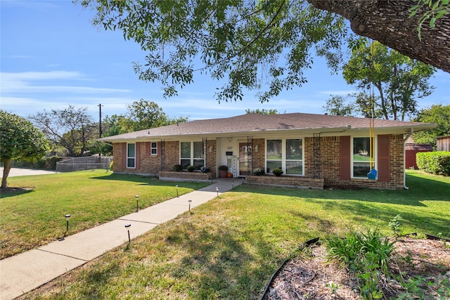 single story home with a front lawn