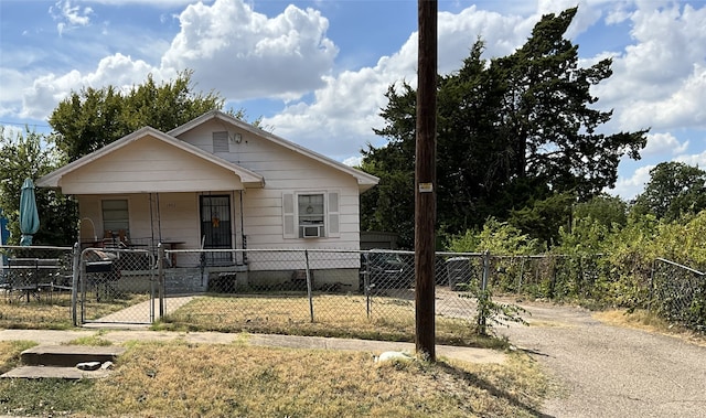 view of front of home featuring cooling unit and a porch