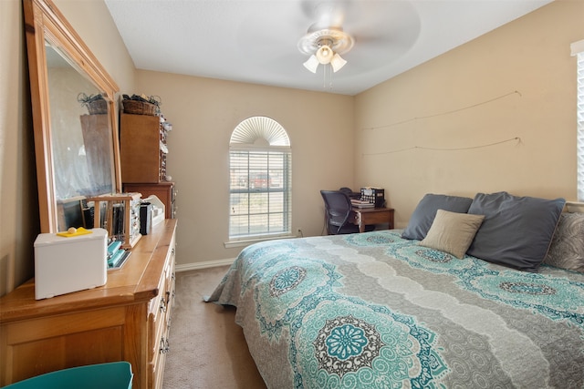 bedroom with light carpet and ceiling fan