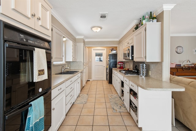 kitchen with black appliances, tasteful backsplash, sink, white cabinetry, and ornamental molding