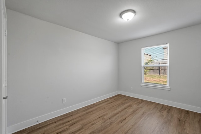 unfurnished room with light hardwood / wood-style flooring