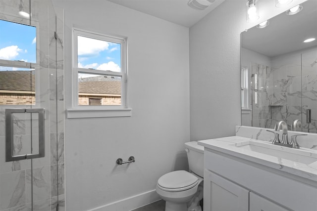 bathroom with toilet, an enclosed shower, and vanity