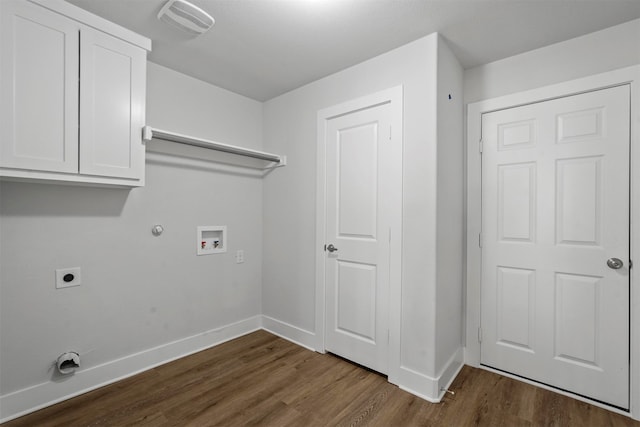 laundry area with hookup for an electric dryer, hookup for a gas dryer, washer hookup, cabinets, and dark hardwood / wood-style floors