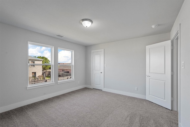 unfurnished bedroom with light carpet