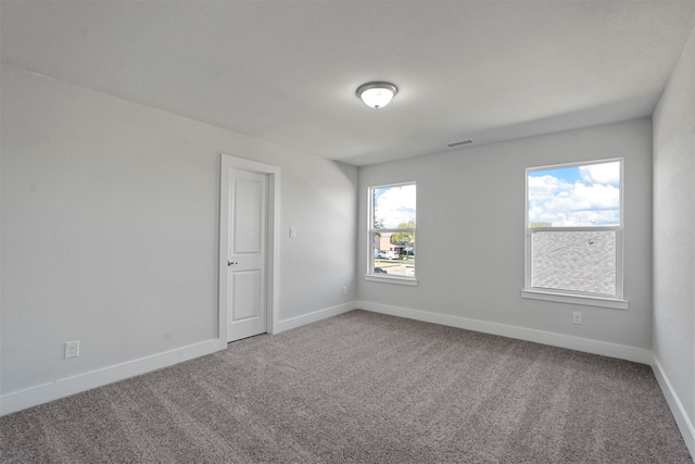 spare room featuring carpet flooring