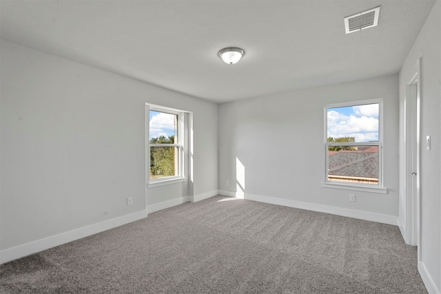 empty room featuring carpet flooring