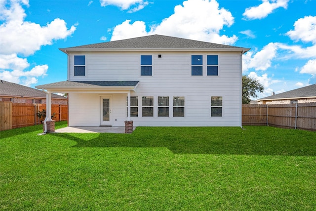 rear view of property with a patio area and a yard