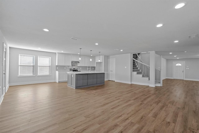 unfurnished living room with light hardwood / wood-style floors