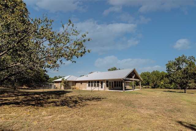 back of house with a yard