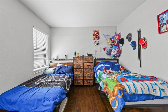 bedroom featuring wood finished floors