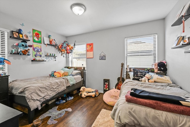 bedroom with wood finished floors