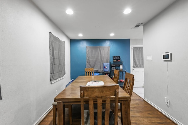 dining area with recessed lighting, baseboards, visible vents, and dark wood-type flooring