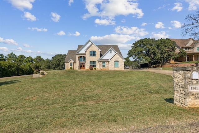 craftsman house featuring a front lawn