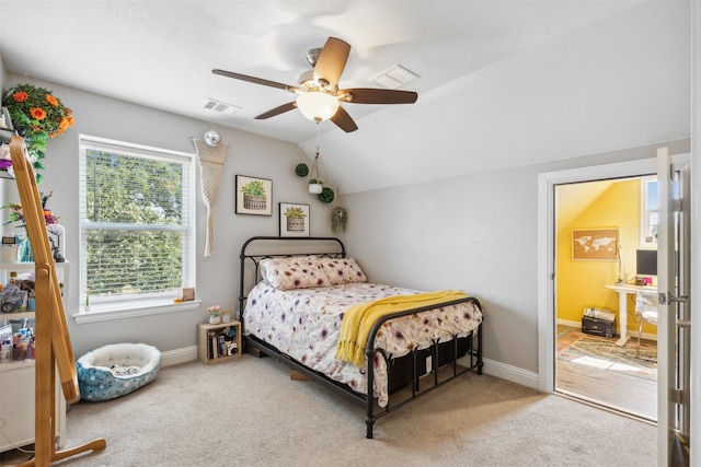 bedroom featuring carpet, ceiling fan, and lofted ceiling