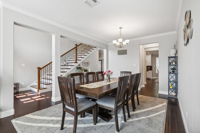 dining room featuring a notable chandelier, crown molding, and dark wood-type flooring