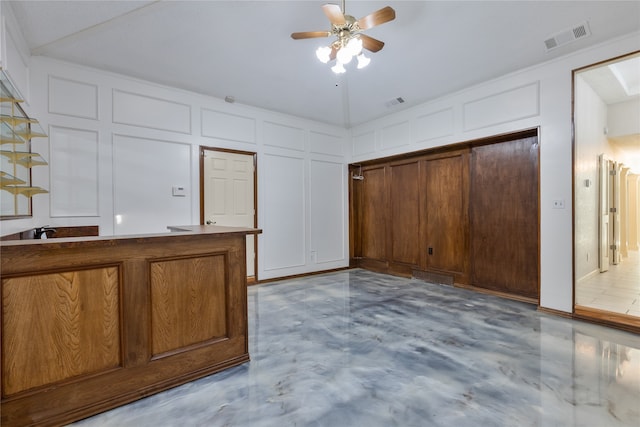 kitchen with ceiling fan and vaulted ceiling