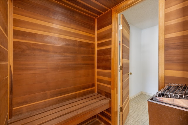 view of sauna with wood walls