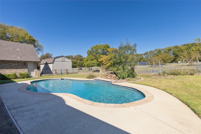 view of pool featuring a patio, a storage shed, and a lawn