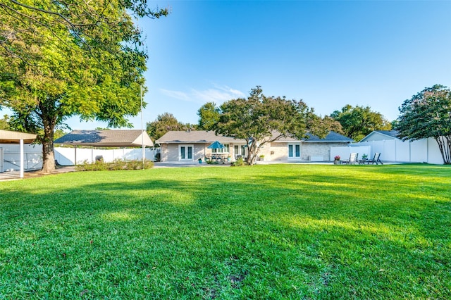 view of yard featuring a patio and a fenced backyard