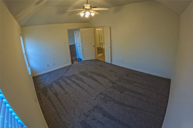 carpeted empty room featuring ceiling fan and lofted ceiling